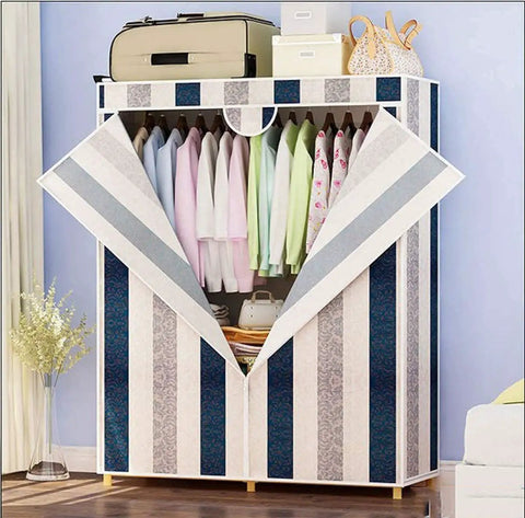 Heavy Duty Portable Closet With Durable Non Woven Fabric Garment Rack And Spacious Storage Shelf Super Easy Assembly For Hella Roomy Extra Clothes Organization Blue 110X45X160Cm with open doors revealing colorful clothing inside.