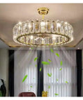 Top Shelf Modern Ceiling Fan Chandelier Combining Invisible Blades With Slick Crystal Accents And Warm Pendant Lighting Delivering Sweet Vibes For Living Rooms And Bedrooms, featuring gold trim and illuminated crystals.