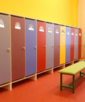 Rainbow Cutouts For Classroom Decor, 45 Pcs Boho Rainbow Name Tags With 100 Glue Dots on colorful cubby lockers in a classroom.