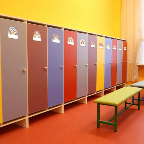 Rainbow Cutouts For Classroom Decor, 45 Pcs Boho Rainbow Name Tags With 100 Glue Dots on colorful cubby lockers in a classroom.