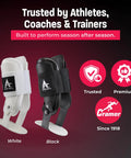 White and black rigid U shaped ankle braces for sprained ankles, medium size, adjustable padding for maximum stability.