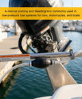 Heavy Duty Manual Bulb Fuel Transfer Pump For Quick Gas And Diesel Priming, 1/4 Inch Hose Kit, shown in use on a boat.