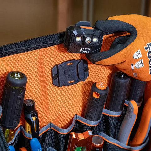 Close-up of Tool Backpack Station Pro Heavy Duty Organizer With 27 Pockets showing interior pockets and tools, orange liner