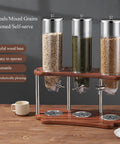 Airtight Cereal Dispenser And Dry Food Storage Container Countertop Organizer No Fuss Game Changer Keeps Oatmeal Coffee Beans Nuts Fresh Smooth Operator Crafted From Food Grade Plastic With Solid Wood Base And Steel Lid Pack Of Three featuring three clear containers on a wood base.