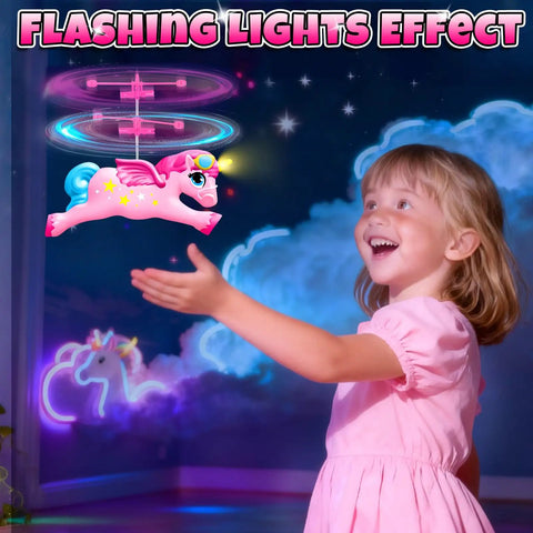 Girl playing with Magical Flying Unicorn Toy For Girls With LED Lights Fairy Flying Ball Helicopter Drone, lit with a night glow.