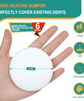 Heavy Duty 3.15 White Silicone Door Stopper Bumpers 6 Pack Wall Protectors held in hand, showing size and smooth surface.