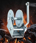 Heavy Duty Carbon Steel Manual Hand Winch With Dual Way Auto Brake System self-locking, illustrated with rugged terrain background