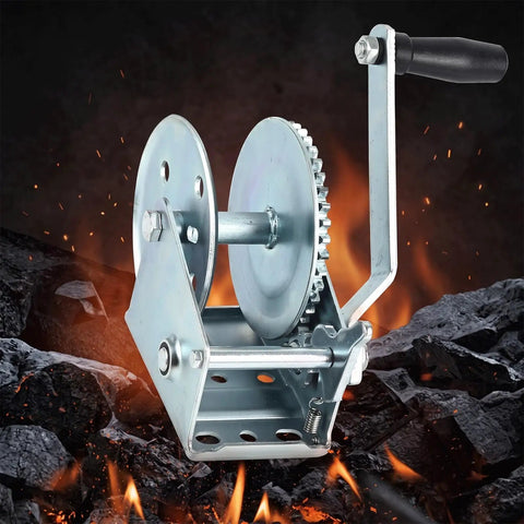 Heavy Duty Carbon Steel Manual Hand Winch With Dual Way Auto Brake System self-locking, illustrated with rugged terrain background