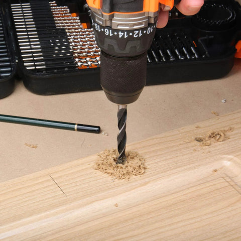 EnerTwist 246-piece drill bit set in plastic carrying case; metal twist drill bit drilling into wood.