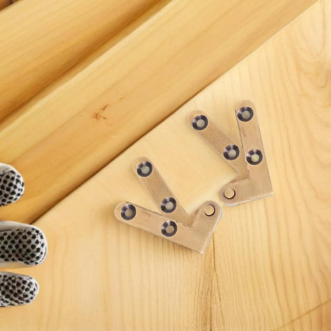 Heavy Duty Bronze Pivot Door Hinges Set With Hidden Self Closing Hardware placed on wooden surface