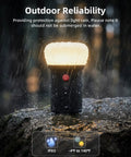 Rechargeable LED Camping Lantern With 6000mAh Battery Emergency Outdoor Tent Light wet in rain on rock, IPX5 rated
