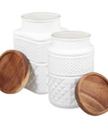 Kick Your Pantry Game With These Two Matte White Glass Storage Jars Boasting Heavy Duty Wood Lids To Keep Coffee Beans And Grain Fresh All Week Because Airtight Seals Are Solid Gold For Smart Kitchen Storage.