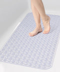 Big Time Grip Non Slip Bathtub Shower Mat Features Heavy Duty Suction Cups For Zero Slip Drains Quick Dry Cutouts Made From Soft Bendable Tpe For Super Chill Foot Comfort And Hassle Free Rinse Clear Thirty Five By Sixteen Inch Layout with foot standing on it.