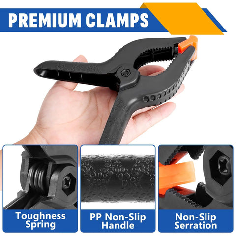 Ten-pack 6-inch black plastic spring clamps with orange tips for crafts, photography, and backdrops.