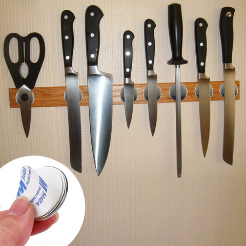 Front view of 20-pack neodymium disc magnets with double-sided adhesive securing knives to a wooden magnetic strip