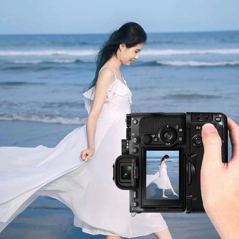 A hand holds a camera with Beast Battery Grip For Alpha Cameras A7 IV A9 II A7R IV A7R V A7S III A1 Replacement Vertical Grip With NP-FZ100.