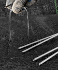 4 Inch 40 Pack 11 Gauge U Shape Garden Stakes Set For Drip Irrigation Lines And Tubing Hoses Heavy Duty Galvanized Landscape Staples For Lawns Weed Barriers Landscape Fabrics And Floor Mats being installed.