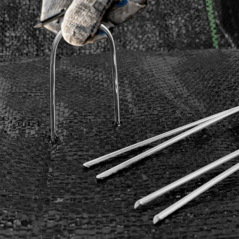 4 Inch 40 Pack 11 Gauge U Shape Garden Stakes Set For Drip Irrigation Lines And Tubing Hoses Heavy Duty Galvanized Landscape Staples For Lawns Weed Barriers Landscape Fabrics And Floor Mats being installed.