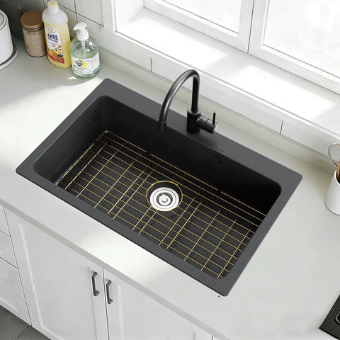 Rock Solid Gold 304 Stainless Steel Sink Grid Protector Covers 28 by 14 Inch Single Bowl with Rear Drain in a black sink.