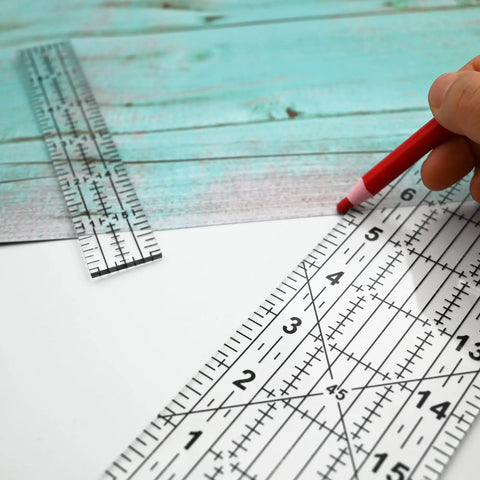 Dead Simple Acrylic Quilting Rulers And Nifty Fabric Cutting Templates For Patchwork Projects with a red marker on fabric.