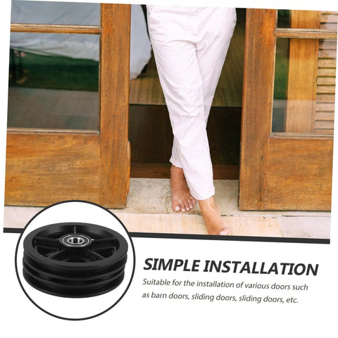 Kickass Heavy Duty Sliding Door Pulley Wheel Kit With Rigid Casters For Barn Door Track System, showing installation with black pulley wheel.