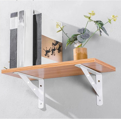 Heavy Duty Triangular Corner Shelf Brackets 2 Pack White Steel Wall Mounts For Scaffold Boards supporting wooden shelf with decor.