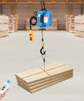 Heavy Duty Electric Hoist With 1100 Lb Capacity And 1500W Motor lifting stacked wooden planks using a remote control.