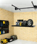 Hardcore Adjustable Overhead Garage Storage Rack With 300 Pound Capacity Rustproof Carbon Steel Ceiling Mount Hanger holding tools and tire.
