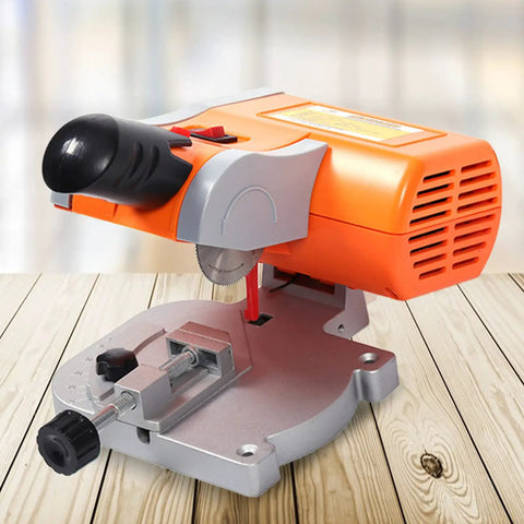 Mini Desktop 0 To 45 Degrees Multi Angle Portable Cutter for arts and crafts, orange unit on wooden surface.