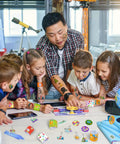 Children at a table using Totally Cool 98 Piece Science Party Favors Bundle With Slap Bracelets, Stickers, Badges, Keychains and Tattoos