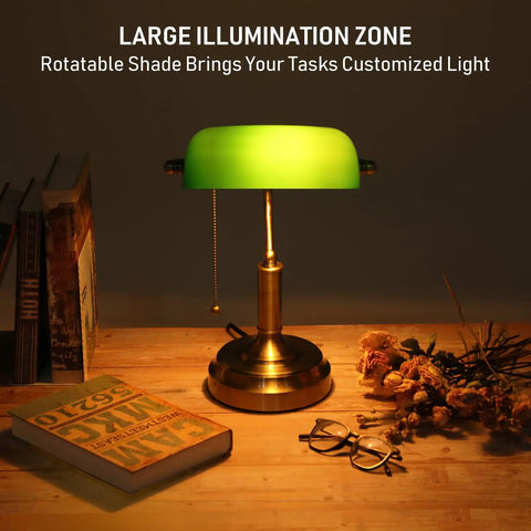 Green Glass Bankers Desk Lamp With Brass Base on wooden desk with books, retro vibe lighting, pull chain switch