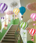 Lit Classroom Ceiling Decor Kit With 12 White Cloud Ornaments And 6 Paper Hot Air Balloon Lanterns displayed in stairway
