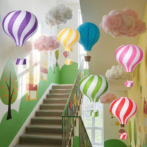 Lit Classroom Ceiling Decor Kit With 12 White Cloud Ornaments And 6 Paper Hot Air Balloon Lanterns displayed in stairway