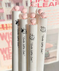 Dope Cute Twistable Cat Paw Pens Set 0.5mm Black Gel Ink Smooth Writing Kawaii Cartoon Kitten Pens with pink paw tops in a group