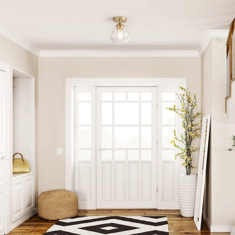Harrow 1 Light Semi Flush Mount Ceiling Light in Matte Brass with Clear Glass Shade in a modern entryway
