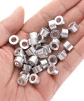 Aluminum Spacer 5mm Bore 10mm OD 6mm Length Standoff For M5 Screws Bolts And Rods, 30 Piece Pack, held in hand
