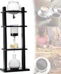 Top Shelf Cold Brew Coffee Maker And Iced Coffee Brewer With Slick Adjustable Dripper For Killer Slow Drip Flavor Brewing Eight Smooth Daily Drinks Using A Nifty 1000ml Chilled Reservoir Setup Today on a counter.