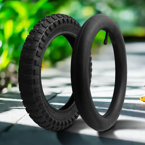 12 Inch Bicycle Tire And Inner Tube Set With Puncture Resistant Outer Tire And AV Valve For Bikes Scooters And Electric Skateboards Ride Ready Tough As Nails Durable Rubber Tubes For Daily Rides, showcasing the rugged tread design and inner tube on display outdoors.
