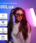 Person holding 360 Degree Magnetic Handheld Light Wand With 2000mAh Battery, 2500-9000K Dimmable RGB Tube Light For Camera.