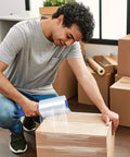 Man using Industrial Grade Clear Hand Stretch Wrap Film Two Pack Eighty Gauge Six Inch Wide One Thousand Feet Heavy Duty Packing Rolls.