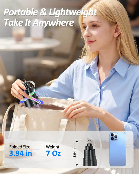 Person placing USB Powered Fly Fans For Tables With LED Light into a bag, highlighting portability and compact size.