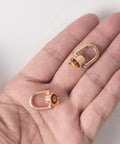 4 Pcs Dope Gold D Rings For Purses Rotatable 360 Degree Metal Hardware With Studs Screw Ball Head Buttons And Rivets, held in a hand