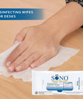 Person using Go To Alcohol Free Medical Grade Disinfecting Wipes Pack Of 2 With 160 Count And Extra Large Sheets For Multiple Surface Cleaning Sanitizer No Bleach Gentle Yet Effective on a desk