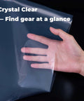 Hand holding Heavy Duty Nylon Pack Liner Bags 20 By 36 Inch 10 Pack Thick Five Point Five Mil Clear Liners for camping gear