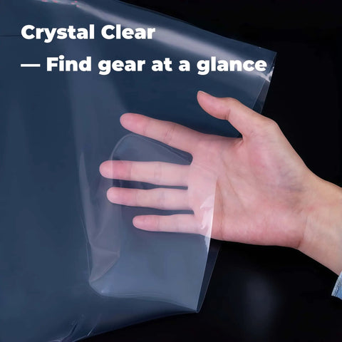 Hand holding Heavy Duty Nylon Pack Liner Bags 20 By 36 Inch 10 Pack Thick Five Point Five Mil Clear Liners for camping gear