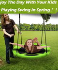 40 Inch Saucer Tree Swing for Kids with 500 lb Weight Capacity Waterproof Platform Swing Seat in use outdoors