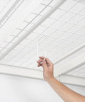 Hand installing Heavy Duty Overhead Storage Rack And Wall Mount Hooks Four Pack Steel Hooks For Bikes Ladders Tools And Gear