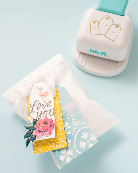 3-In-1 Round Tag Punch for Crafting and Scrapbooking, multi-color tool shown with gift tags and decorative designs.