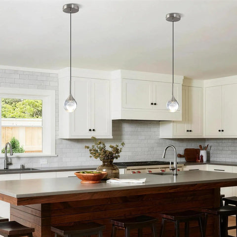 MKonpeny Modern Crystal Moon Pendant Light, 3000K 7W led pendant light kitchen island in a stylish kitchen.