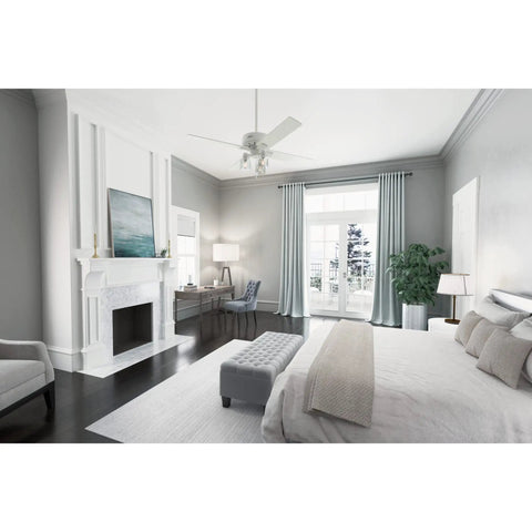 Modern 52 Inch Matte White Ceiling Fan With LED Light And Pull Chain Multi Speed WhisperWind Motor in elegant bedroom interior